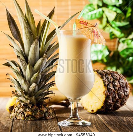 Pina Colada On Wooden Background Garnished Pineapple