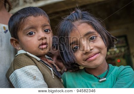 GODWAR REGION, INDIA - 12 FEBRUARY 2015: Young girl holds baby. Loss of tradition gains pace from every new generation. Rabari or Rewari are an Indian community in the state of Gujarat.