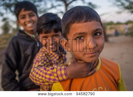 GODWAR REGION, INDIA - 12 FEBRUARY 2015: Three boys from Rabari tribe. Loss of tradition gains pace from every new generation. Rabari or Rewari are an Indian community in the state of Gujarat.