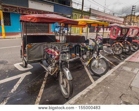 Rickshaws On A  Street