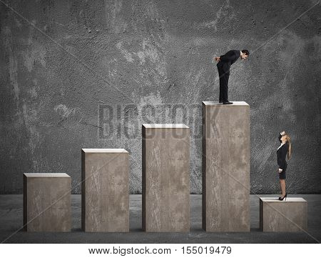 Businessman looks at a businesswoman in the lowest step of the statistical