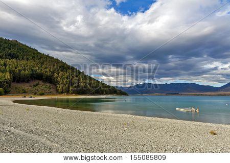 Tekapo New Zealand - February 2016: People swimming at at Lake Tekapo South Island of New Zealand