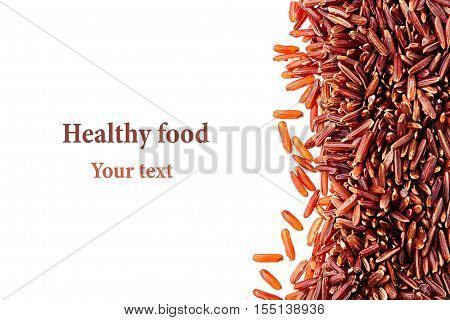 Border of red rice close-up on white background. Isolated. Decorative frame of wild brown unpolished rice.