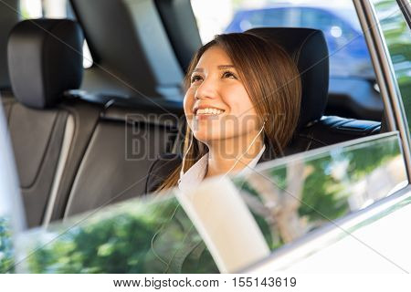 Businesswoman Relaxing And Listening To Music