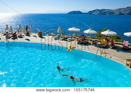 Crete Greece - June 17 2006: Tourists in an hotel pool in Agia Pelagia bay