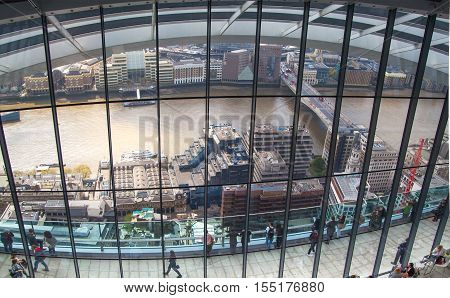 LONDON, UK - APRIL 22, 2015: People in the restaurant of the Sky Garden Walkie-Talkie building. Viewing platform is heist UK garden, locates at the 32 floor and offers amazing skyline of London city.