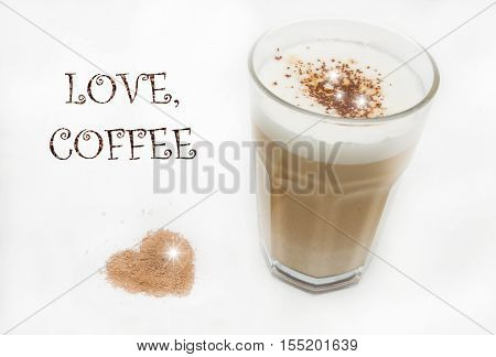 Latte machiato coffee with sign and a heart