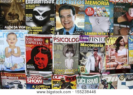 RIO DE JANEIRO BRAZIL - JAN 31 2015: titels of magazines at a kiosk in Rio. Glamor and crime is still a very potential selling issue in Newspapers and periodical magazines.