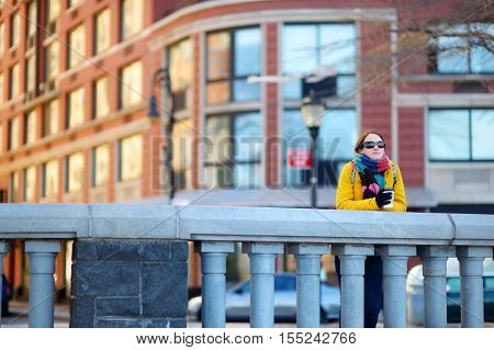 Beautiful Young Woman Drinking Coffee On Sunny Spring Day In New York