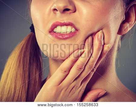 Woman Suffering From Tooth Pain