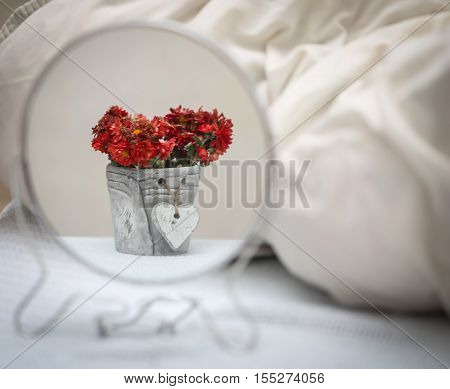 Reflection Of Flowers In The Mirror