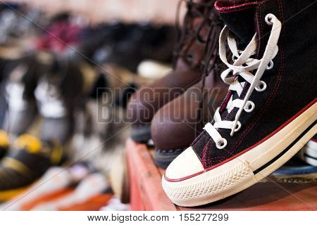 Vintaeg Black shoes in 2nd shop on blury background.