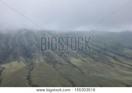 Climbing the volcano Bromo Indonesia. Clouds obscured the crater and green valley