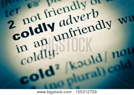 Close Up Of Old English Dictionary Page With Word Coldly