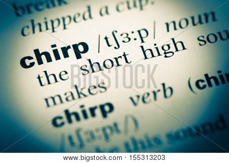 Close Up Of Old English Dictionary Page With Word Chirp