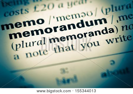 Close Up Of Old English Dictionary Page With Word Memorandum