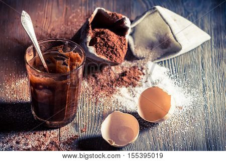 Dessert composed of eggs and sugar on old wooden table