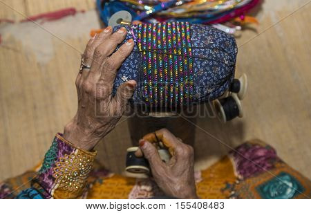 Omaniya Making A Bracelet