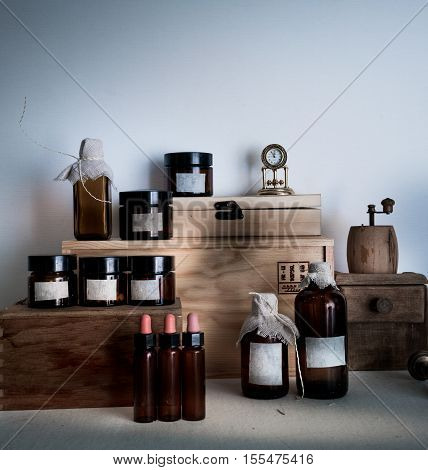 pharmacy. bottles, jars clock on wooden shelves