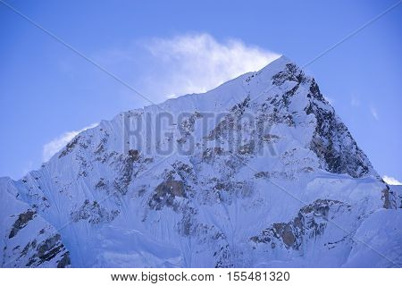 closed up view of Lhotse peak with snow blowing on top from Gorak Shep. During the way to Everest base camp. Sagarmatha national park. Nepal.