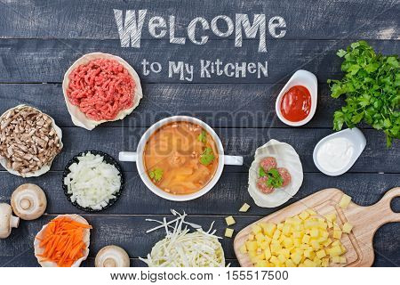Сabbage mushrooms potatoes onions beef herbs as ingredients for cooking soup with meatballs. Top view.