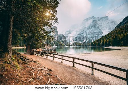 Great scene the alpine lake Braies (Pragser Wildsee). Location place Dolomite national park Fanes-Sennes-Braies, Italy. Europe. Cross processed retro and vintage style. Instagram effect. Beauty world.