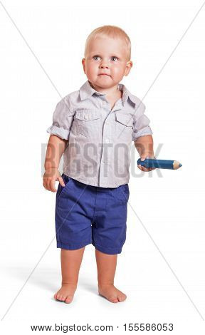 Charming boy in a shirt and shorts standing and holding a big pencil isolated on white background.