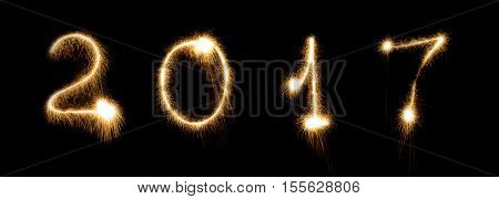 2017 firework sparkler bright glowing new years eve font lettering number date. Isolated