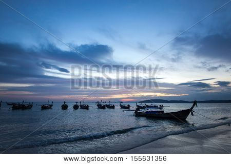 Traditional thai longtail boat at sunset Ao Nang Beach. Thailand, Krabi province.