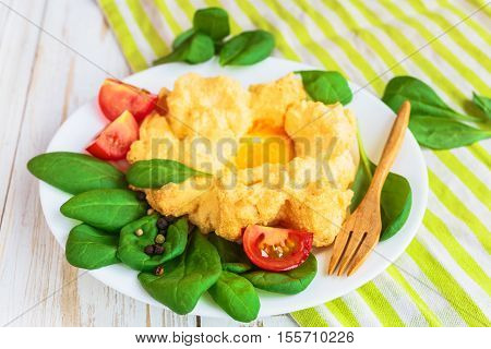Baked Eggs Orsini With Spinach And Cherry Tomatoes
