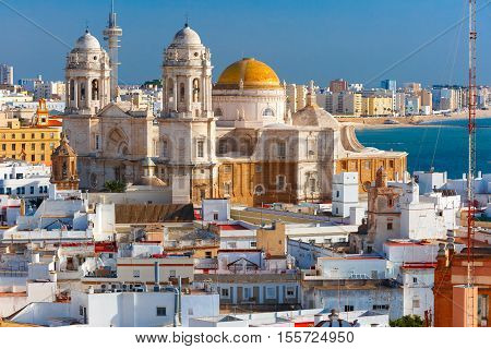 Aerial view of the old city rooftops and Cathedral de Santa Cruz in the morning from tower Tavira in Cadiz, Andalusia, Spain