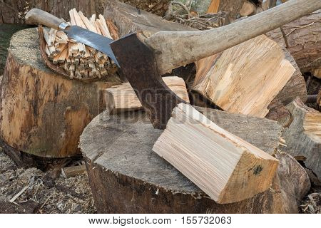 Hatchet By Chunks Of Firewood