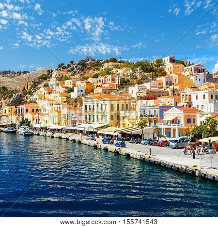 Greece. Dodecanesse. Island Symi Simi . Colorful houses on rocks
