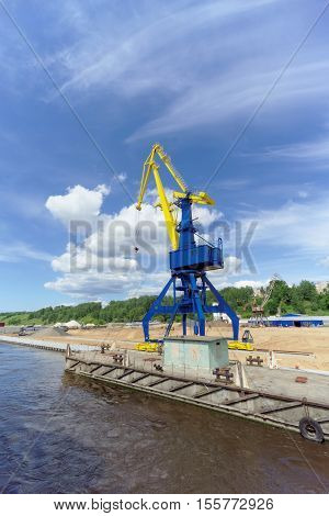 Gorodets, Russia. - June 2.2016. Blue Portal Crane With A Yellow Arrow On The Cargo Wharf In Gorodet