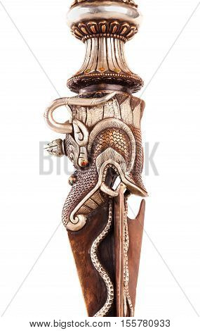 Ritual blade of Phurba which is used in Tantric Buddhism of destruction of all concepts and attachment to an ego. Isolated on a white background.