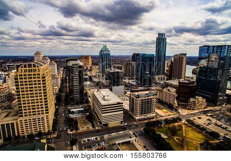 Dramatic High contrast Aerial Shot Austin Texas Skyline Cityscape in the center of Downtown with Frost Bank tower and the Tall Austonian in view with office buildings