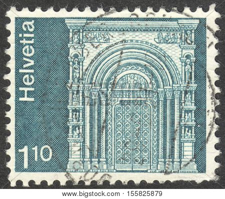 MOSCOW RUSSIA - CIRCA OCTOBER 2016: a post stamp printed in SWITZERLAND shows Gallus Gate Munster Basel the series 
