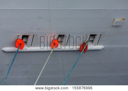 Three Ropes into Ships Hull from Pier
