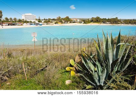 Lonely sea coast. Island surrounding deep blie water