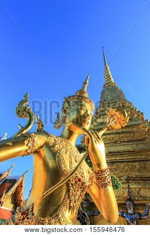 Golden statue in side public royal temple, Bangkok, Thailand