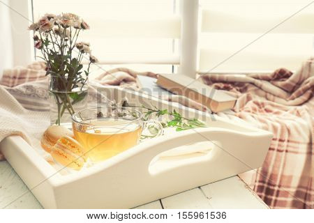 Cup Of Tea, Macaroons, Chrysanthemum Flowers And Books