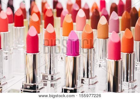 Set of color lipsticks on white background.