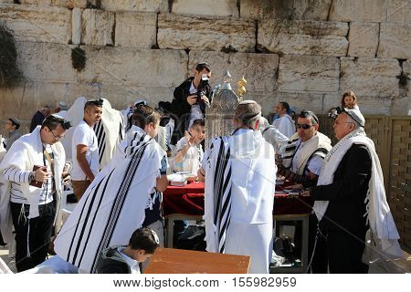 Jerusalem, Israel - November 2 , 2016: Bar Mitzvah Ceremony at the Western Wall in Jerusalem Old City. Bar Mitzvah is the Jewish rite of passage from boyhood to manhood.