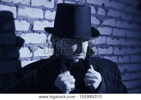 Victorian Man In The Black Coat, Top Hat And In A Tie