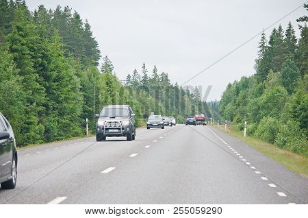 Sweden - June 29, 2012: Meeting Car Traffic On Roadtrip Through Forest Countryside On June 29, 2012 