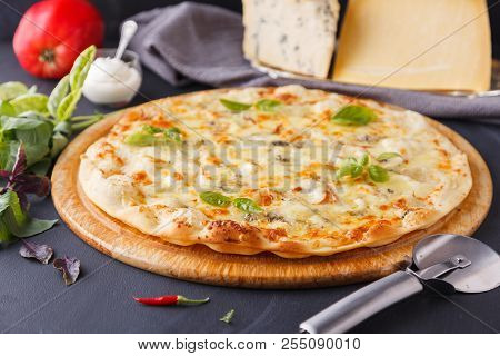 Pizza Four Cheese. A Whole Delisios Pizza On A Chalk Board Surrounded By Ingredients