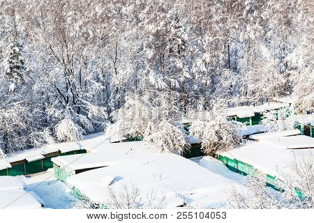 Above View Of Snow-covered Garages Near Urban Timiryazevsky Park In Moscow City In Sunny Winter Day