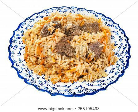 Above View Of Cooked Pilaf (central Asian Dish From Rice With Meat And Vegetable) On Local Ceramic P