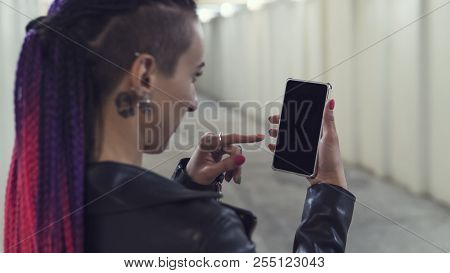 Woman Looking Smartphone. Sexy Young Beautiful Girl With A Non-standard Appearance Listens To Music 