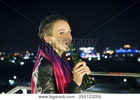 Female Tongue In A Bottle. Closeup View Of Female Facial Body Part Of Sexual Lips Licking With Tongu